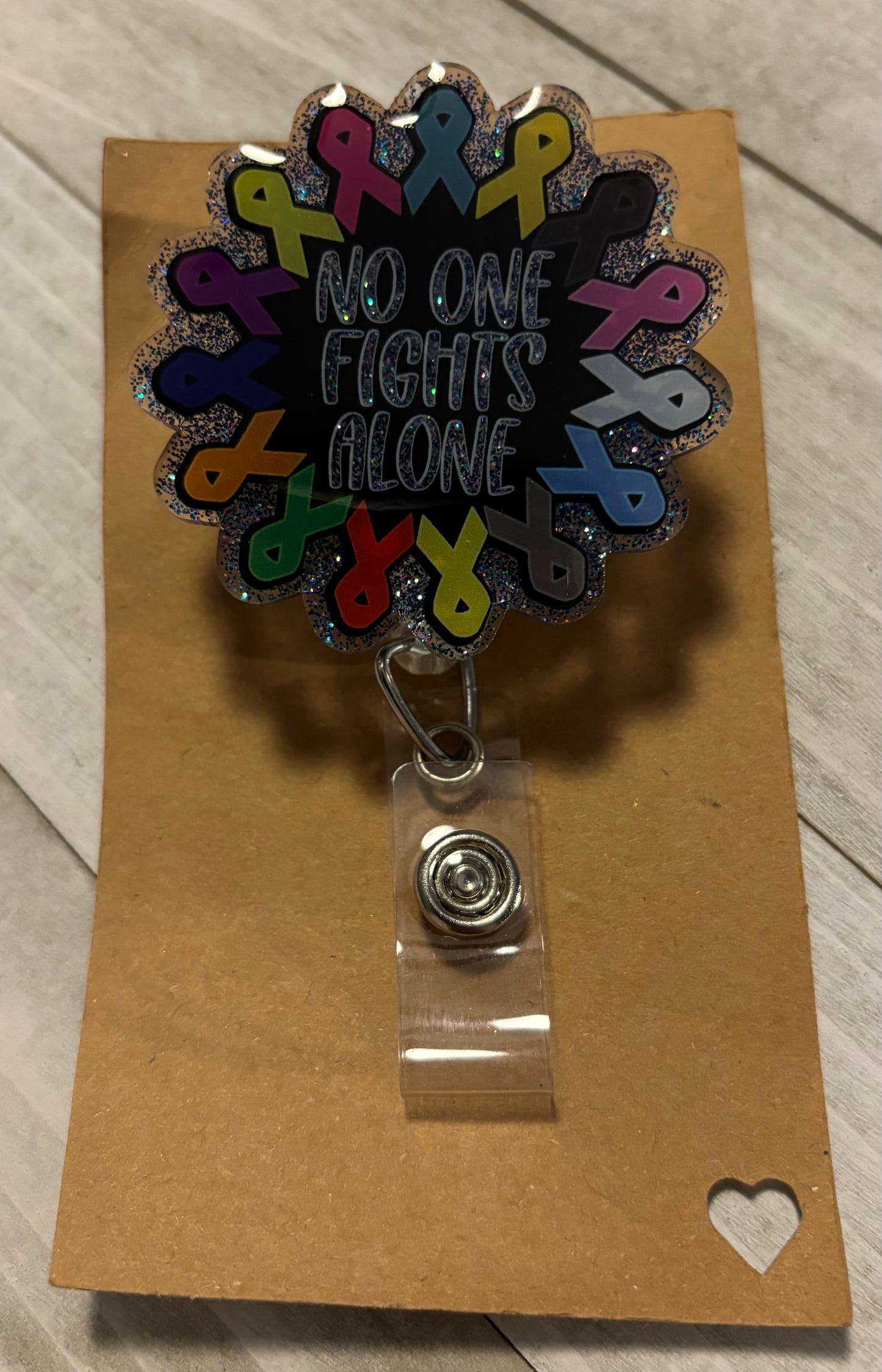 No one fights alone badge reel